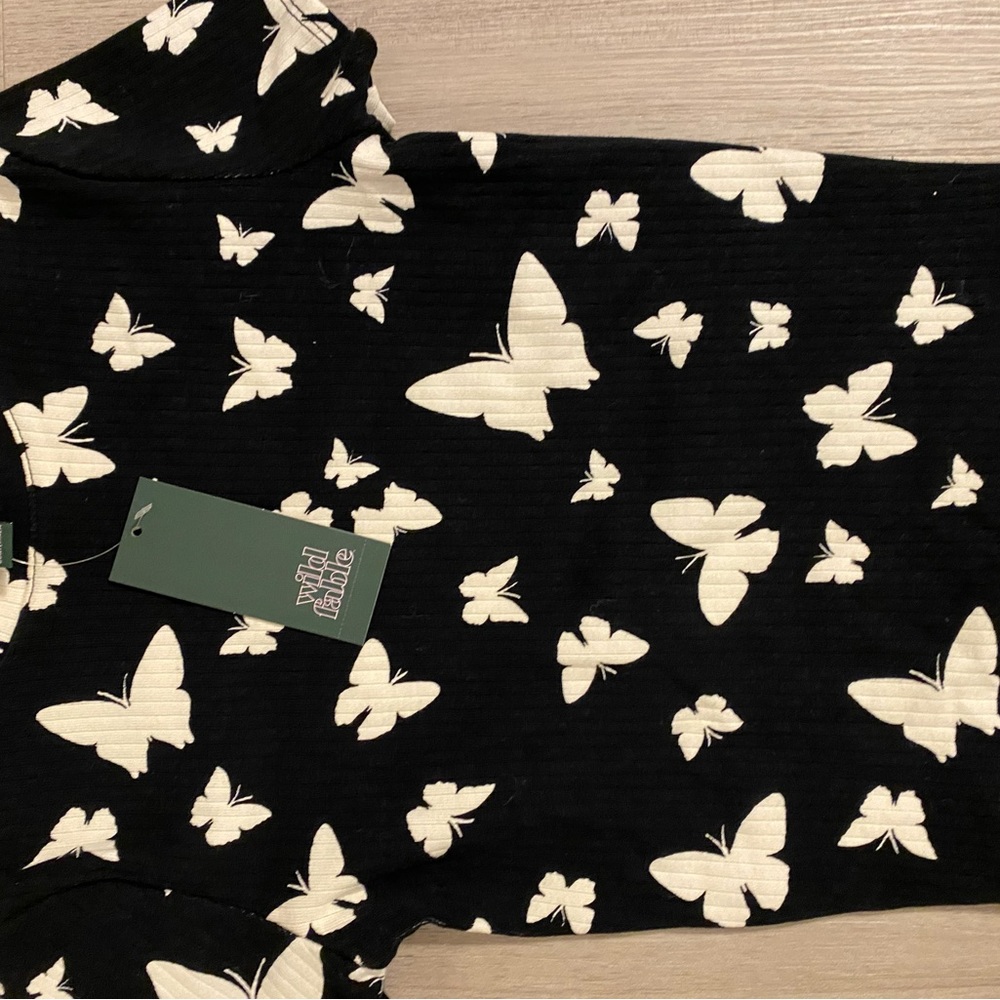 Black with White butterflies on it.